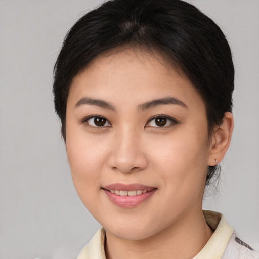 Joyful white young-adult female with medium  brown hair and brown eyes