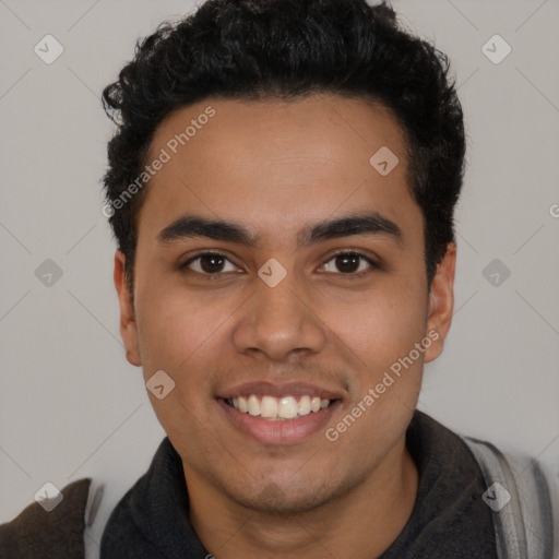 Joyful latino young-adult male with short  black hair and brown eyes