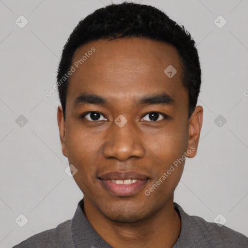 Joyful black young-adult male with short  black hair and brown eyes