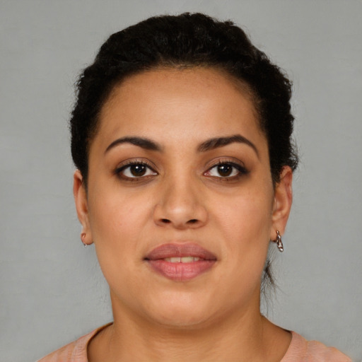 Joyful latino young-adult female with short  brown hair and brown eyes