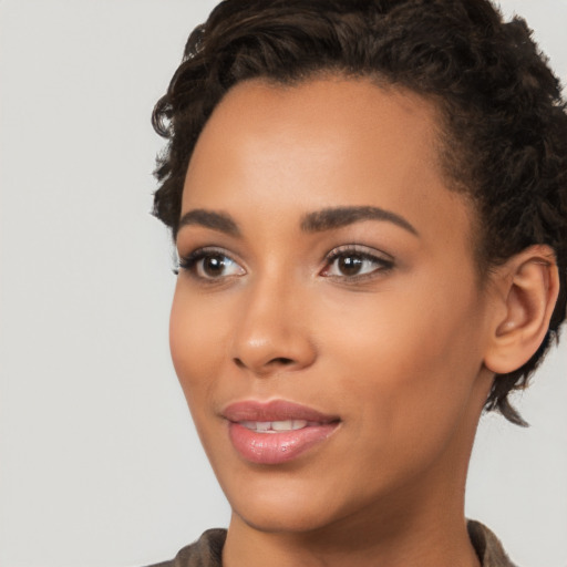 Joyful latino young-adult female with short  brown hair and brown eyes