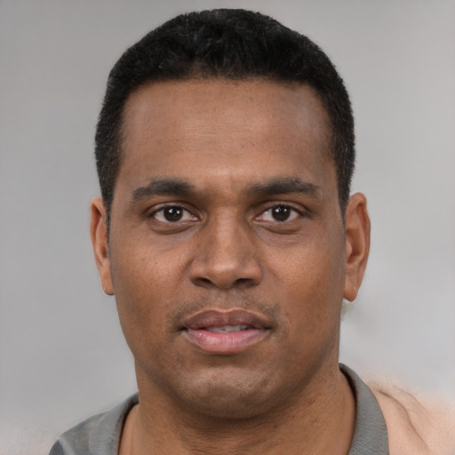 Neutral latino young-adult male with short  black hair and brown eyes