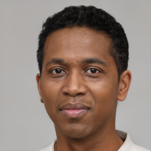 Neutral black adult male with short  black hair and brown eyes