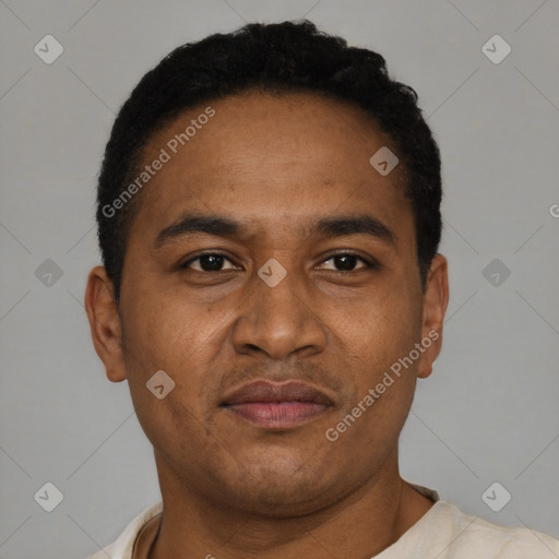 Joyful latino adult male with short  brown hair and brown eyes