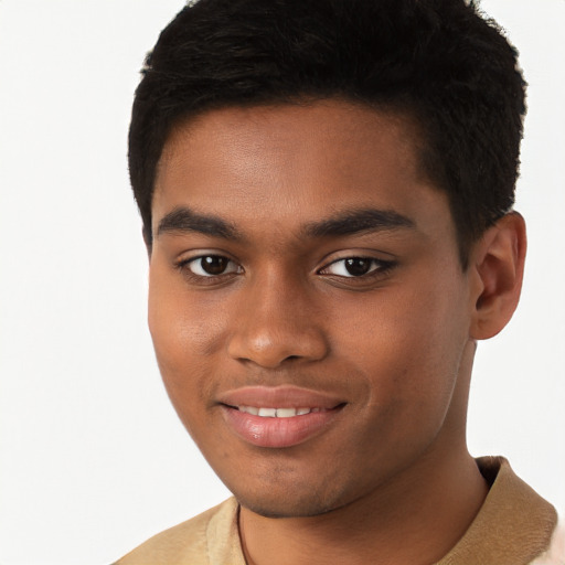 Joyful black young-adult male with short  brown hair and brown eyes