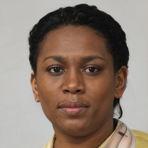 Neutral black young-adult female with short  black hair and brown eyes