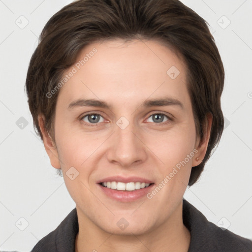 Joyful white young-adult female with short  brown hair and grey eyes