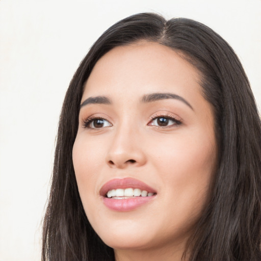 Joyful white young-adult female with long  black hair and brown eyes