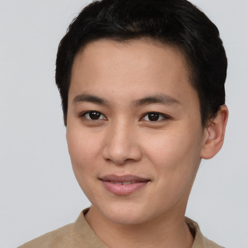 Joyful asian young-adult male with short  brown hair and brown eyes
