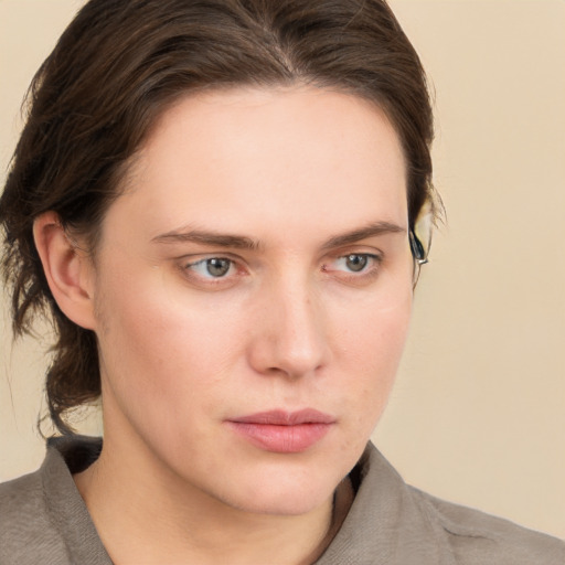 Neutral white young-adult female with medium  brown hair and grey eyes