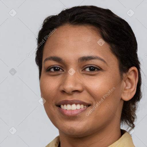 Joyful latino young-adult female with short  brown hair and brown eyes