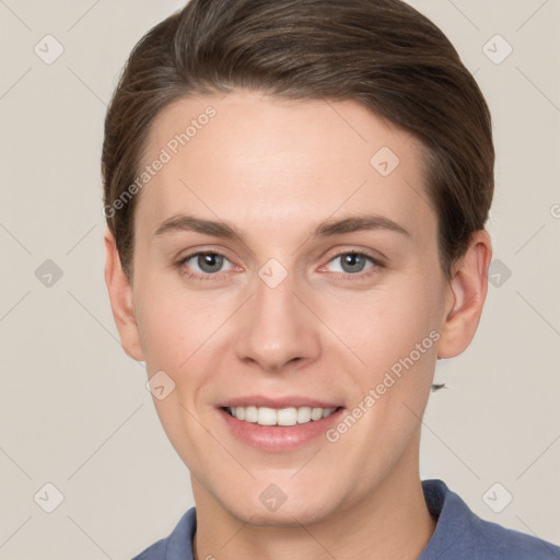 Joyful white young-adult female with short  brown hair and grey eyes