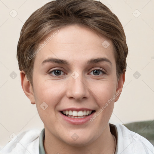 Joyful white young-adult female with short  brown hair and grey eyes