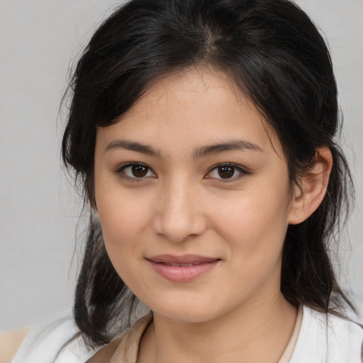 Joyful asian young-adult female with medium  brown hair and brown eyes