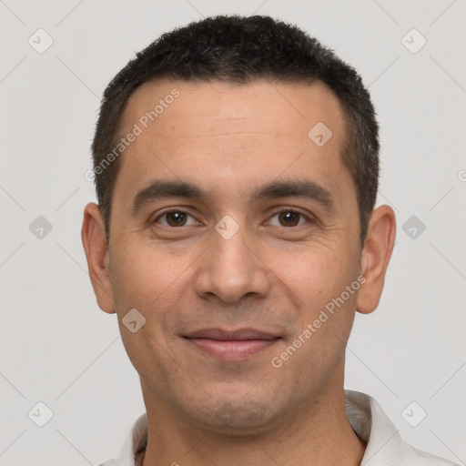 Joyful white young-adult male with short  black hair and brown eyes