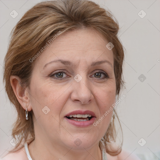 Joyful white adult female with medium  brown hair and blue eyes