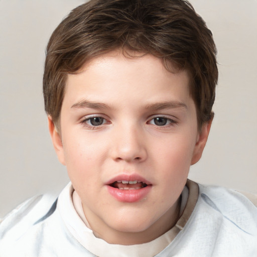 Joyful white child male with short  brown hair and brown eyes