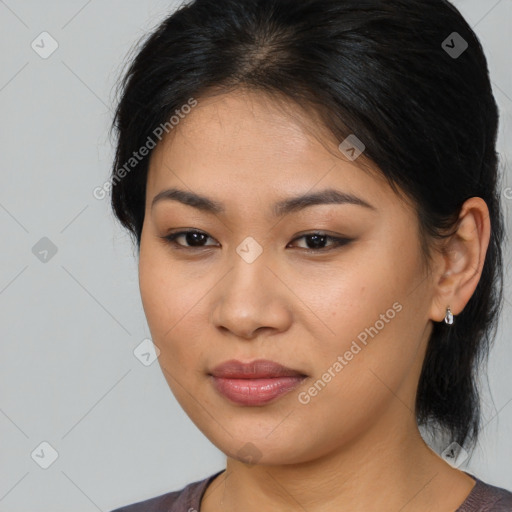 Joyful latino young-adult female with medium  brown hair and brown eyes