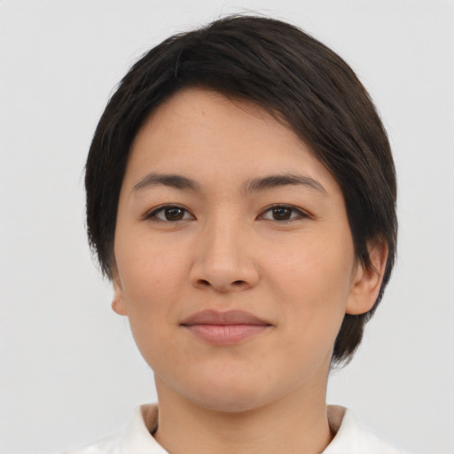 Joyful asian young-adult female with short  brown hair and brown eyes