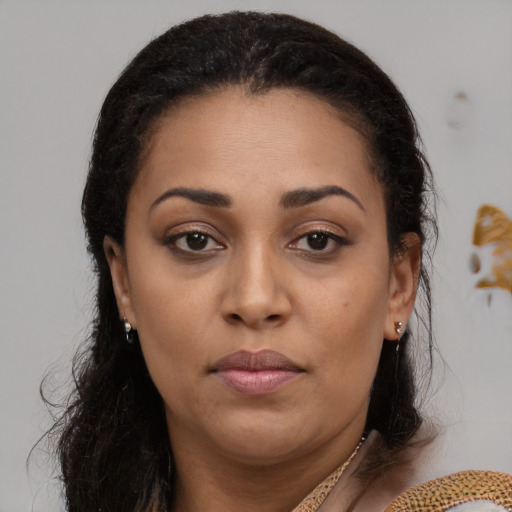 Neutral black young-adult female with long  brown hair and brown eyes