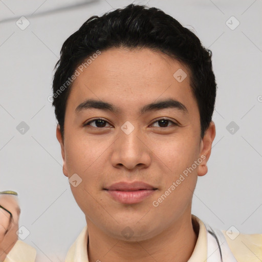 Joyful asian young-adult male with short  black hair and brown eyes