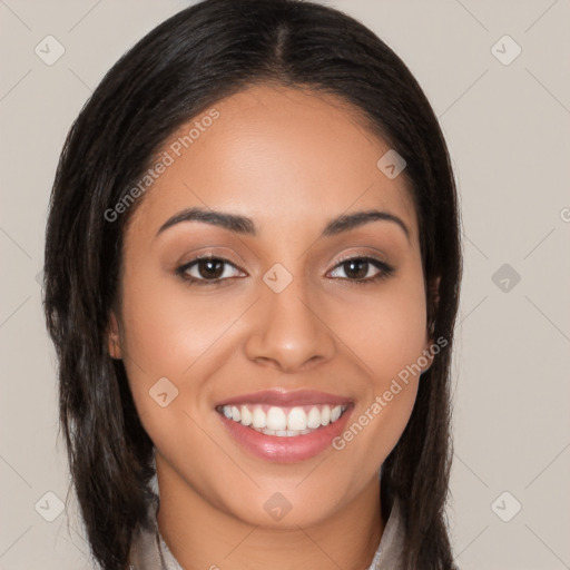 Joyful latino young-adult female with long  brown hair and brown eyes