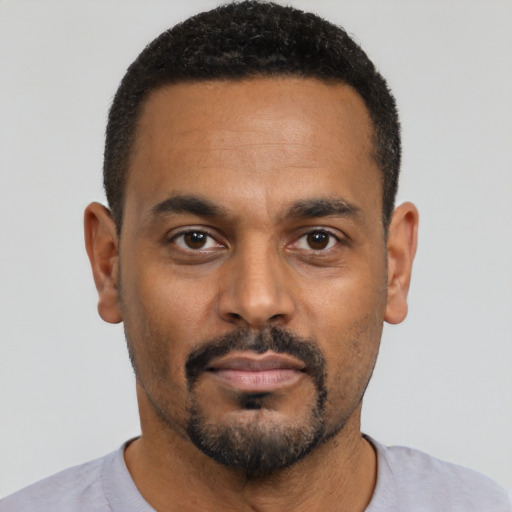 Neutral black young-adult male with short  black hair and brown eyes