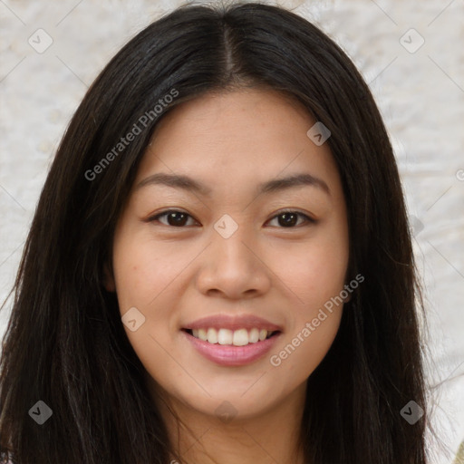 Joyful asian young-adult female with long  brown hair and brown eyes