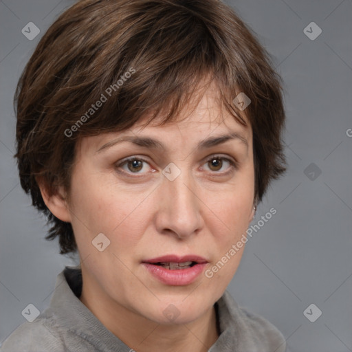 Joyful white adult female with medium  brown hair and grey eyes