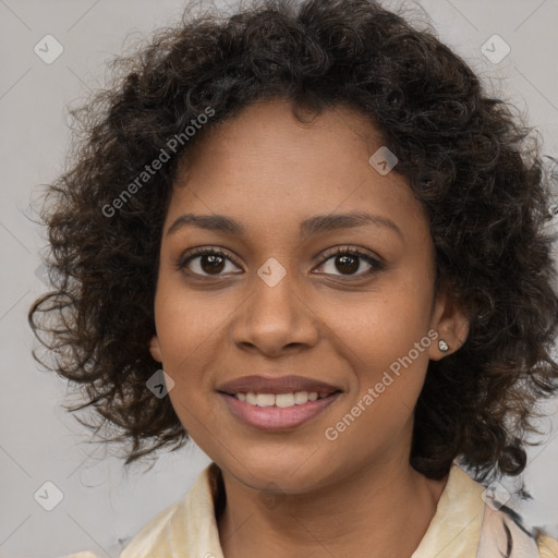 Joyful black young-adult female with medium  brown hair and brown eyes