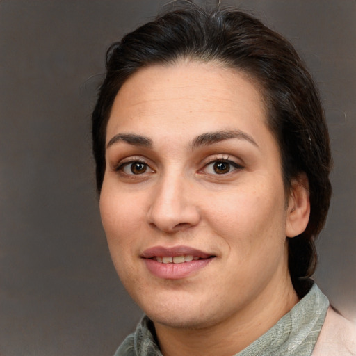 Joyful white young-adult female with medium  brown hair and brown eyes