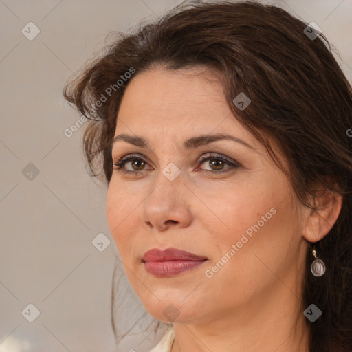 Joyful white adult female with medium  brown hair and brown eyes