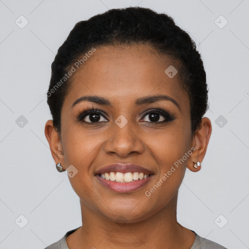 Joyful black young-adult female with short  brown hair and brown eyes