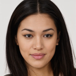 Joyful asian young-adult female with long  brown hair and brown eyes