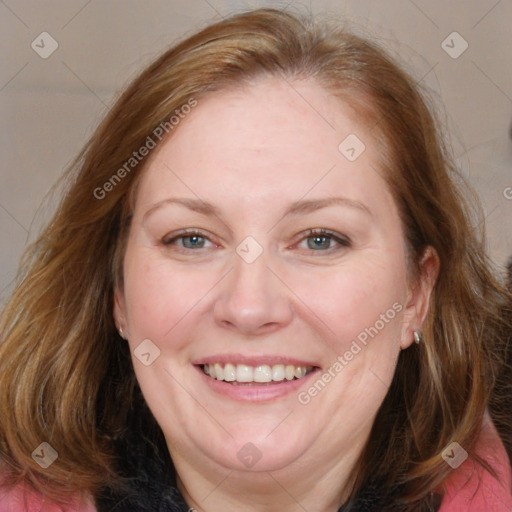 Joyful white adult female with medium  brown hair and blue eyes