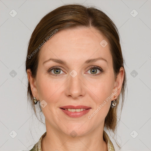 Joyful white adult female with medium  brown hair and grey eyes