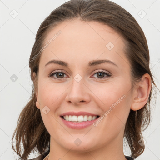 Joyful white young-adult female with long  brown hair and grey eyes