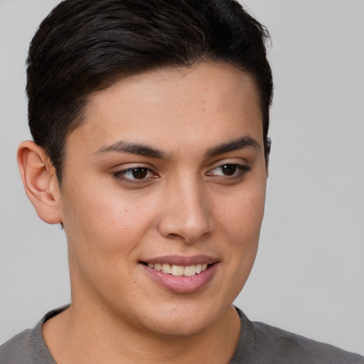 Joyful white young-adult female with short  brown hair and brown eyes