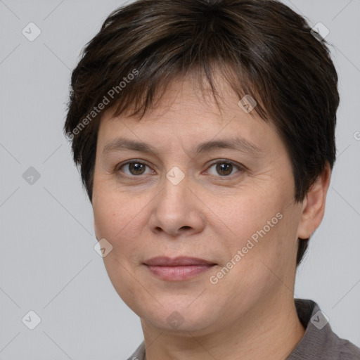 Joyful white adult female with short  brown hair and brown eyes