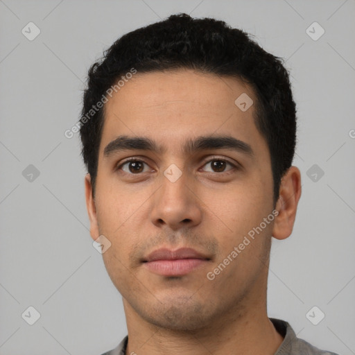 Neutral latino young-adult male with short  black hair and brown eyes