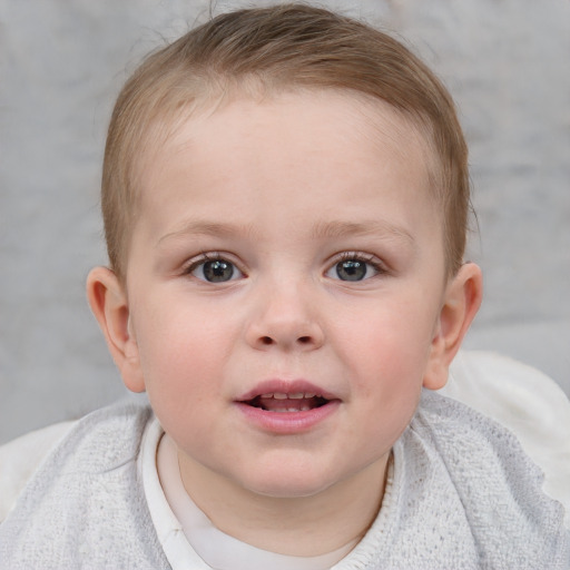 Joyful white child female with short  brown hair and blue eyes