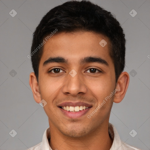 Joyful latino young-adult male with short  brown hair and brown eyes