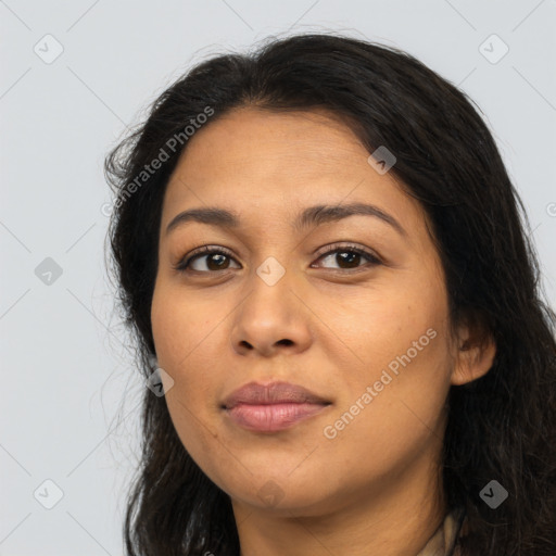 Joyful latino young-adult female with long  black hair and brown eyes