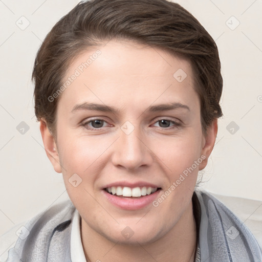 Joyful white young-adult female with short  brown hair and grey eyes