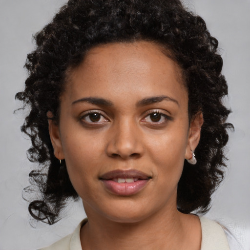 Joyful black young-adult female with medium  black hair and brown eyes