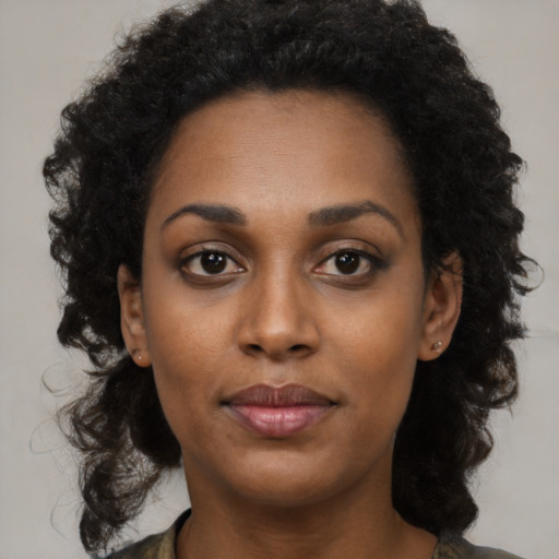 Neutral black young-adult female with long  black hair and brown eyes