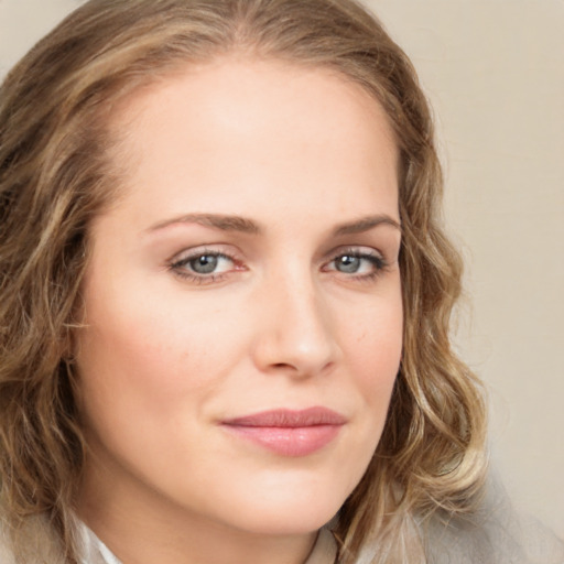 Joyful white young-adult female with long  brown hair and green eyes