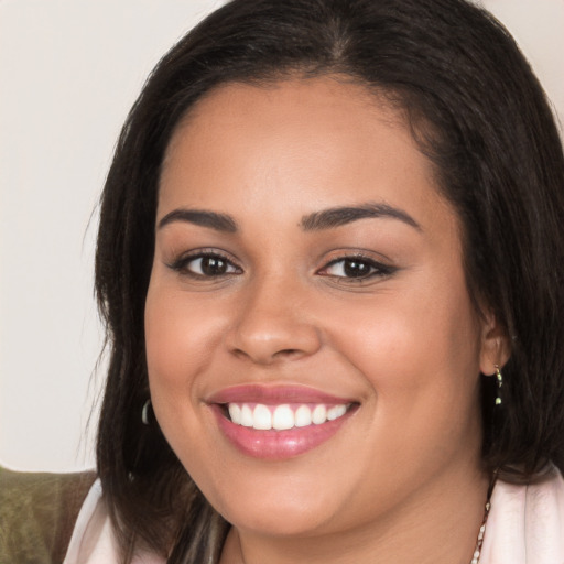 Joyful white young-adult female with long  brown hair and brown eyes