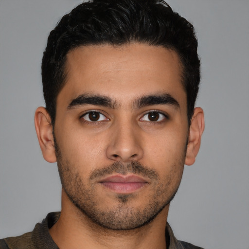 Neutral latino young-adult male with short  brown hair and brown eyes