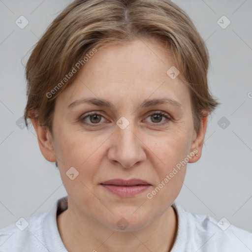 Joyful white adult female with short  brown hair and grey eyes